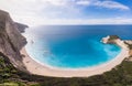 Aerial beautiful beach and water bay in the greek spectacular coast line. Turquoise blue transparent water, unique rocky cliffs,