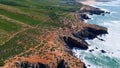 Aerial beautiful littoral landscape with stormy sea crashing of rocky shoreline.