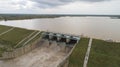 Aerial bird eye of water reservoir flood gates open to release water during monsoon flood from dam at raichur, India