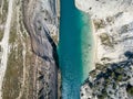 Aerial bird`s eye view photo taken by drone of famous Corinth Canal with turquoise water, Peloponnese, Greece. The Royalty Free Stock Photo