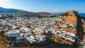 Aerial birds eye view drone photo of village Lindos, Rhodes island, Dodecanese, Greece. Sunset panorama with castle, Mediterranean Royalty Free Stock Photo