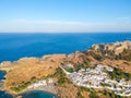 Aerial birds eye view drone photo of village Lindos, Rhodes island, Dodecanese, Greece. Sunset panorama with castle, Mediterranean Royalty Free Stock Photo