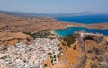 Aerial birds eye view drone photo of village Lindos, Rhodes island, Dodecanese, Greece. Sunset panorama with castle, Mediterranean