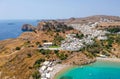 Aerial birds eye view drone photo of village Lindos, Rhodes island, Dodecanese, Greece. Sunset panorama with castle, Mediterranean