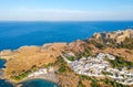Aerial birds eye view drone photo of village Lindos, Rhodes island, Dodecanese, Greece. Sunset panorama with castle, Mediterranean