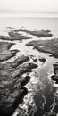 Aerial Black And White Photography Of Rocky Beach And Sea