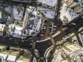 Aerial black and white winter top view of modern city with tall buildings, parked and moving cars along streets with road marking Royalty Free Stock Photo