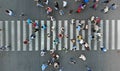 Aerial. Blurred background with pedestrian crosswalk and crowd of people.