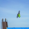 Aerial BMX stunt. Young unrecognizable bike rider performing air trick back flip. Extreme sport, youth culture and Royalty Free Stock Photo