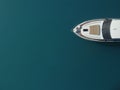 Aerial yacht on calm sea. Luxury cruise trip. View from above of white boat on deep blue water. Aerial top down view of Royalty Free Stock Photo