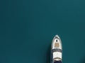 Aerial yacht on calm sea. Luxury cruise trip. View from above of white boat on deep blue water. Aerial top down view of Royalty Free Stock Photo