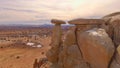 AERIAL: Breathtaking view of a cliff overlooking the desert in Utah in winter.