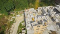 Aerial Building Process of Construction Site. Engineers crane and city Royalty Free Stock Photo