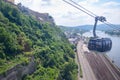 Aerial cable car way to mountains with road and river view