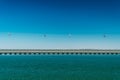 Aerial Cable Cars And Vasco da Gama Bridge In Lisbon