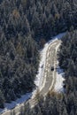 Aerial of a car on road in a forest with snow Royalty Free Stock Photo