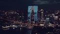 Aerial of CBD buildings by Jinji Lake at night in Suzhou, China