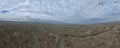 Aerial Cinematic slow motion shot of Drone Flying over a large herd of wild horses galloping fast across the steppe. Royalty Free Stock Photo