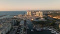Aerial Cinematic view of Herzlia marina full of yachts, sailboats and boats in Mediterranean city during golden hour
