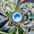 Aerial city view with crossroads and roads, houses, buildings, parks and parking lots. Sunny summer panoramic image Royalty Free Stock Photo