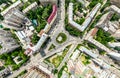 Aerial city view with crossroads and roads, houses, buildings, parks and parking lots. Sunny summer panoramic image Royalty Free Stock Photo