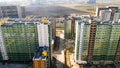 Aerial city view with crossroads, roads, houses, and other buildings. Journey. Buildings colored in green and yellow