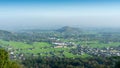 Aerial city view from a hill in the morning with a blue sky background