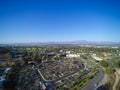 Aerial city view with roads, buildings, parks and parking lots. Royalty Free Stock Photo