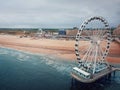 Aerial cityscape of the Ferris Wheel and the de Pier in Hague, The Netherlands. Gloomy day near the North sea with a view to the Royalty Free Stock Photo