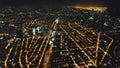 Aerial cityscape at night. Illuminated streets of Manila downtown at traffic route. Urban transport