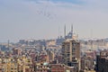 Aerial cityscape view of old Cairo, Egypt with old buildings and Citadel of Egypt in far distance Royalty Free Stock Photo