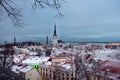 Aerial cityscape view of Tallinn Old Medieval Town on winter day. St. Olaf`s Church spire visible in the distance Royalty Free Stock Photo