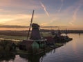 Aerial of classic dutch windmills at the Zaanse Schans during a stunning sunrise Royalty Free Stock Photo