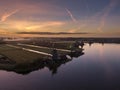 Aerial of classic dutch windmills at the Zaanse Schans during a stunning sunrise Royalty Free Stock Photo