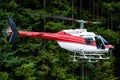 Aerial closeup of a Black Tusk Bell 206 Jet Ranger at Grouse Mountain, Vancouver