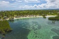 Aerial of a coconut tree lined beach with cottages at Pangangan Island, Calape, Bohol, Philippines Royalty Free Stock Photo
