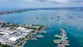 Aerial container terminal of Benoa Harbour with stacks of the boxes and a red command tower under light blue sky Royalty Free Stock Photo