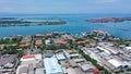 Aerial container terminal of Benoa Harbour with stacks of the boxes and a red command tower under light blue sky Royalty Free Stock Photo