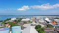 Aerial container terminal of Benoa Harbour with stacks of the boxes and a red command tower under light blue sky Royalty Free Stock Photo