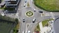 Aerial day shot above Buna Ziua district in Cluj, Romania. Top down roundabout traffic