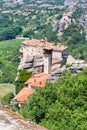 Aerial daylight view on monastery at coast of mountains