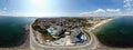 Aerial 360 Degree full sphere Panoramic photo view of the beach front on the beach of Sunny Beach in Bulgaria showing the