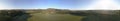 Aerial 360 degrees panorama over hills and polo fields at sunset