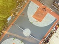 aerial directly above view of street basketball court competition with the people playing