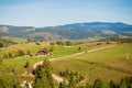 Aerial dnone view Top view of forest wooden house with beautiful mountains Royalty Free Stock Photo