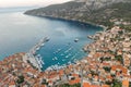 Aerial done shot of Komiza town port on Vis Island in Croatia before sunrise