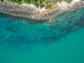 Aerial down view of Double Island, palm Cove looking into crystal clear water