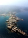 aerial dron view of Punta Cabalo Lighthouse from the sea in Arousa Island, Spain. Royalty Free Stock Photo