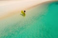 Aerial drone aerial view of Beautiful girl having fun on the sunny tropical beach. Seychelles