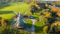 Aerial drone beautiful view on old traditional windmill in middle autumn. Germany  rural landscape in sunny evening Royalty Free Stock Photo